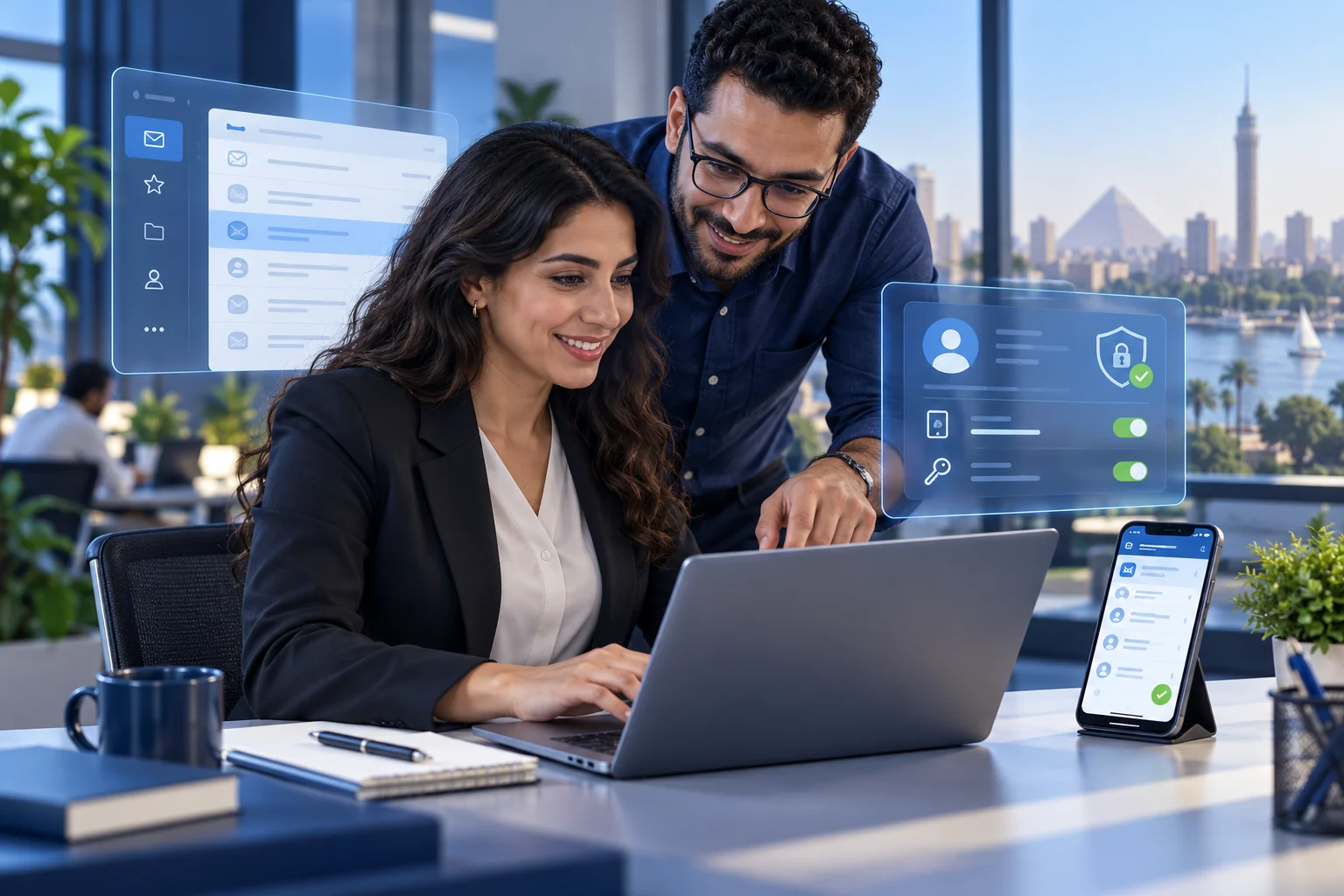 Specialist configuring secure corporate email on desktop and mobile